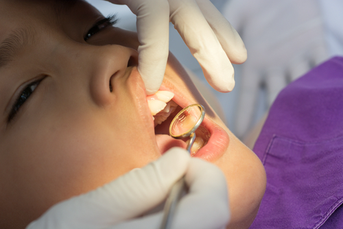 Dental exam , small kid in dental clinic.
